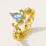 side view close up of Sterling silver gold-plated topaz crown ring