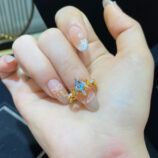 handheld close-up of Sterling silver gold-plated topaz crown ring