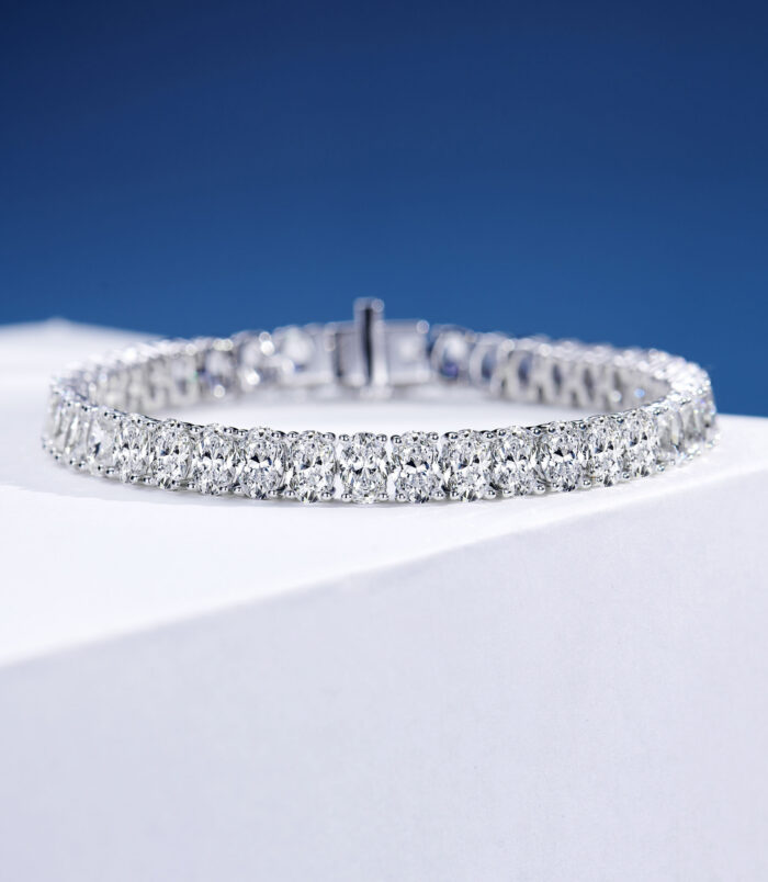 Classic Single-Row Oval-Cut Tennis-Style Sterling Silver Bracelet Single-row tennis-style sterling silver bracelet with round clear stones, polished finish.