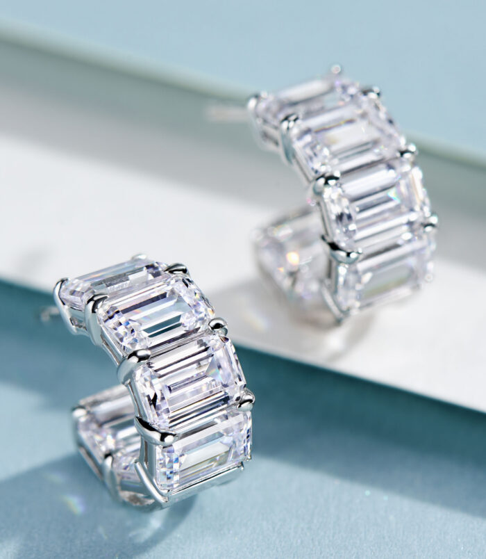 side view close-up of Sleek Sterling Silver Baguette-Cut Cubic Zirconia Huggie Hoop Earrings