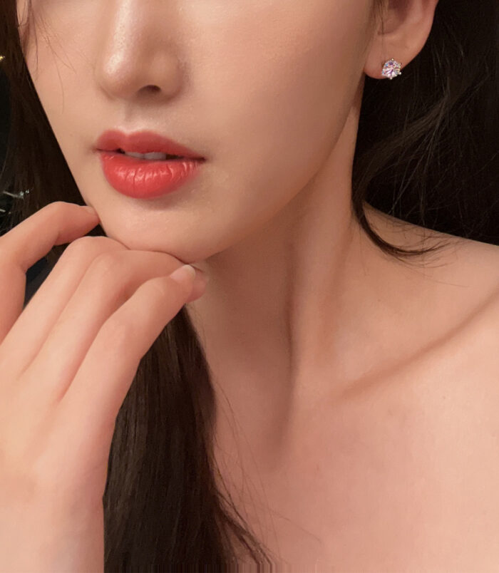 Classic Six-Prong Sterling Silver Stud Earrings wearing effect Classic Six-Prong Sterling Silver Stud Earrings worn on a model's ear