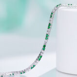 side view of Alternating Green & Clear Stone Tennis-Style Sterling Silver Bracelet, showing its sleek and smooth edges