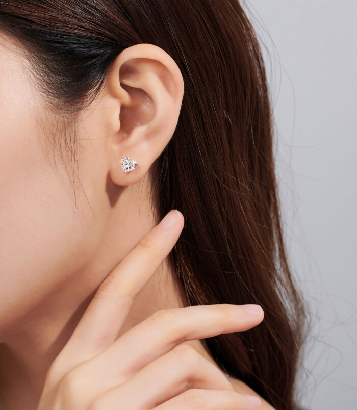 Romantic Heart-Shaped Sterling Silver Stud Earrings model display Romantic Heart-Shaped Sterling Silver Stud Earrings displayed on a model's ear