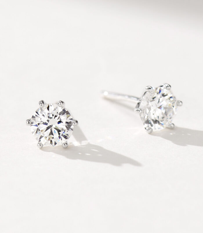 Classic six-prong Brilliant-Cut Sterling Silver Stud Earrings side view side view close-up of gold plated Classic six-prong Brilliant-Cut Sterling Silver Stud Earrings