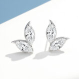 A pair of marquise-cut diamond stud earrings in an elegant leaf-shaped sterling silver setting, displayed against a clean white background.