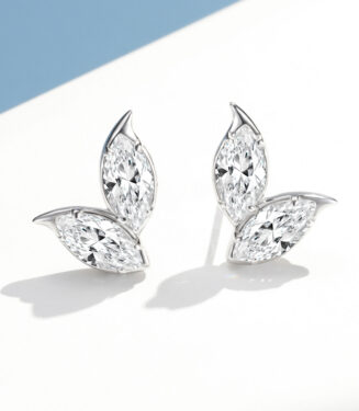 A pair of marquise-cut diamond stud earrings in an elegant leaf-shaped sterling silver setting, displayed against a clean white background.