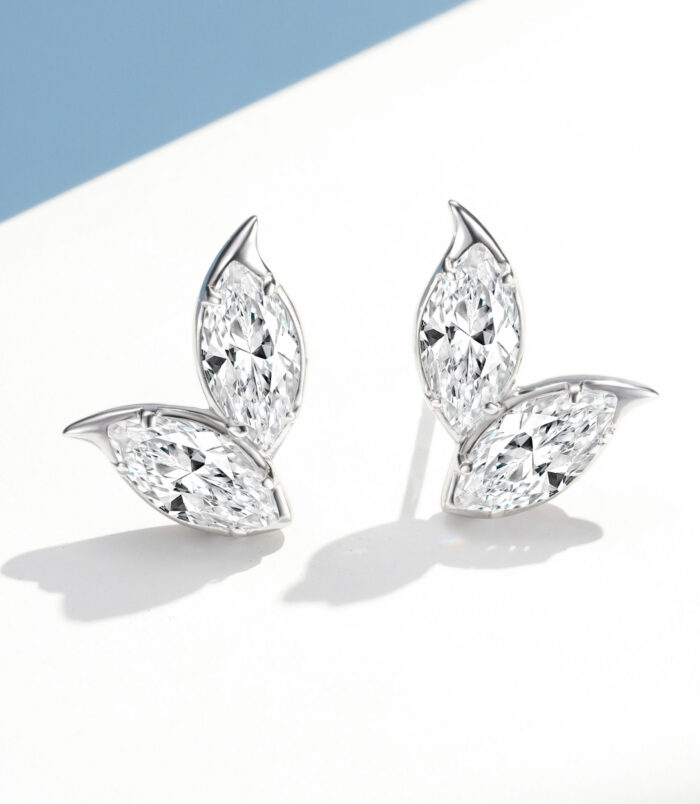 A pair of marquise-cut diamond stud earrings in an elegant leaf-shaped sterling silver setting, displayed against a clean white background.