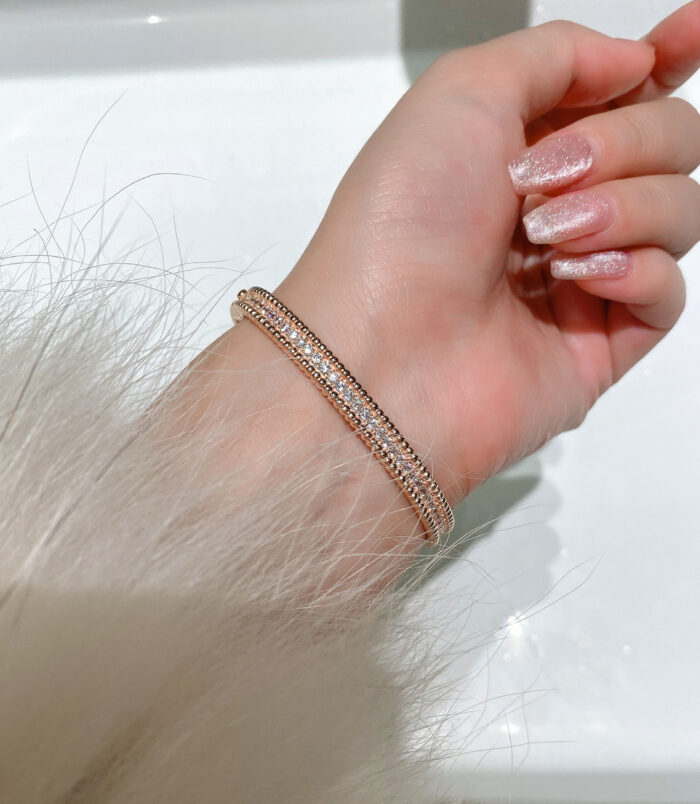 Rose gold plated Double-Row Round-Cut Tennis-Style Sterling Silver jewelry set on a wrist