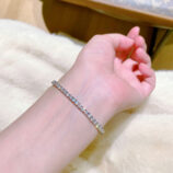 Round-Cut Tennis-Style Sterling Silver Bracelet on a wrist