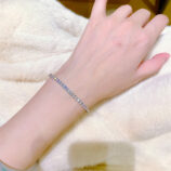 Round-Cut Tennis-Style Sterling Silver Bracelet on a hand