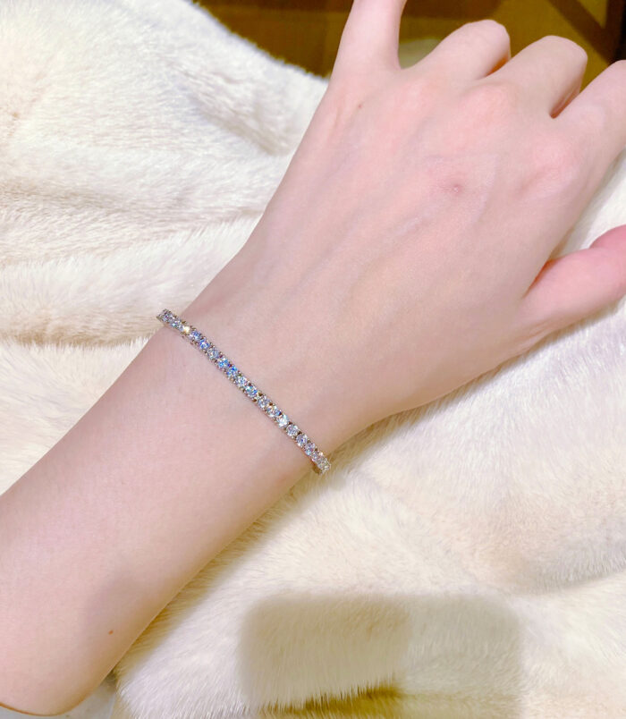 Round-Cut Tennis-Style Sterling Silver Bracelet on a hand