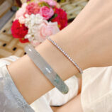 Minimalist Mini Tennis Silver Bracelet worn on model's hand