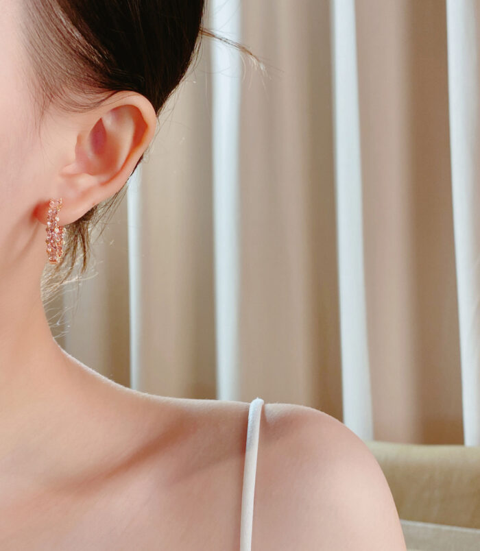 Elegant Pink Gemstone Hoop Earrings worn on a model's ear