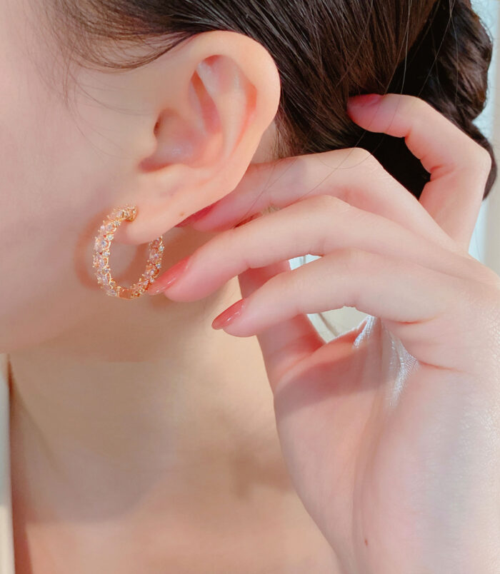 Elegant Pink Gemstone Hoop Earrings displayed on a model's ear