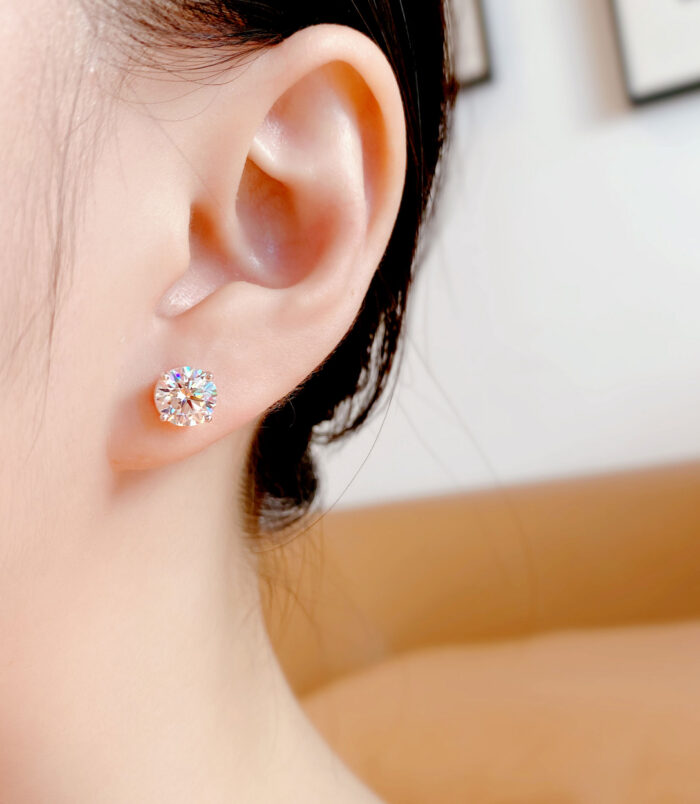 Four-Prong Sterling Silver Stud Earrings model display Four-Prong Sterling Silver Stud Earrings displayed on a model's ear