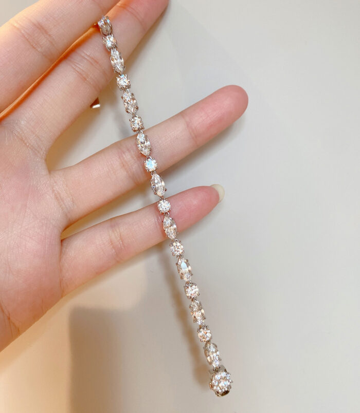 hand held close up of spliced Multi-Cut Sterling Silver Bracelet