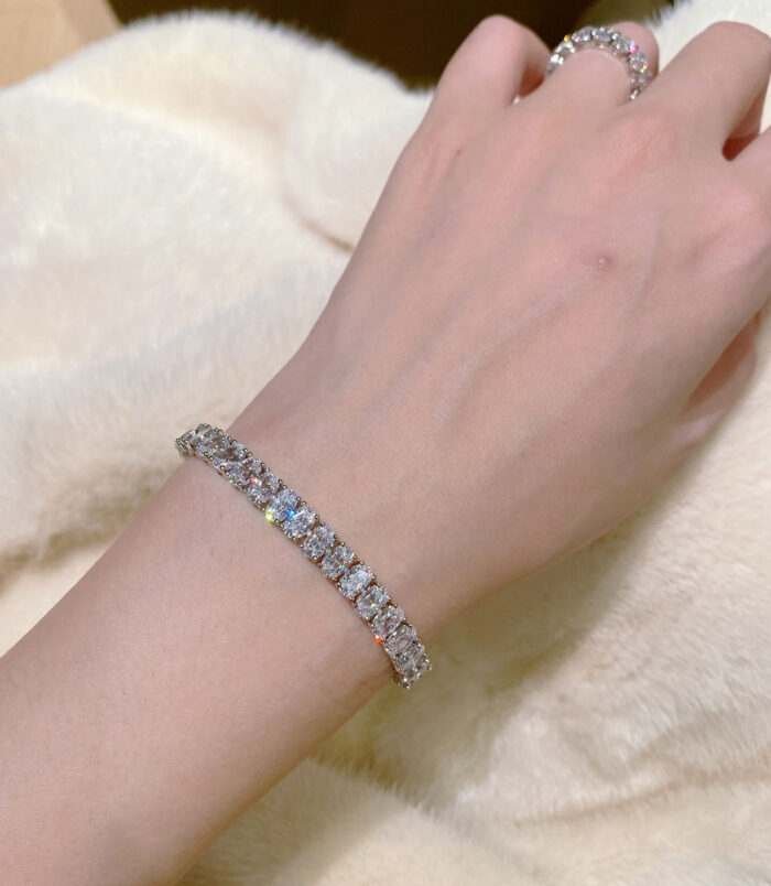 Classic Oval-Cut Tennis Sterling Silver Bracelet wearing effect Classic Oval-Cut Tennis Sterling Silver Bracelet on a wrist