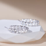 inner side close up of Sterling Silver Pavé-Set Huggie Hoop Earrings