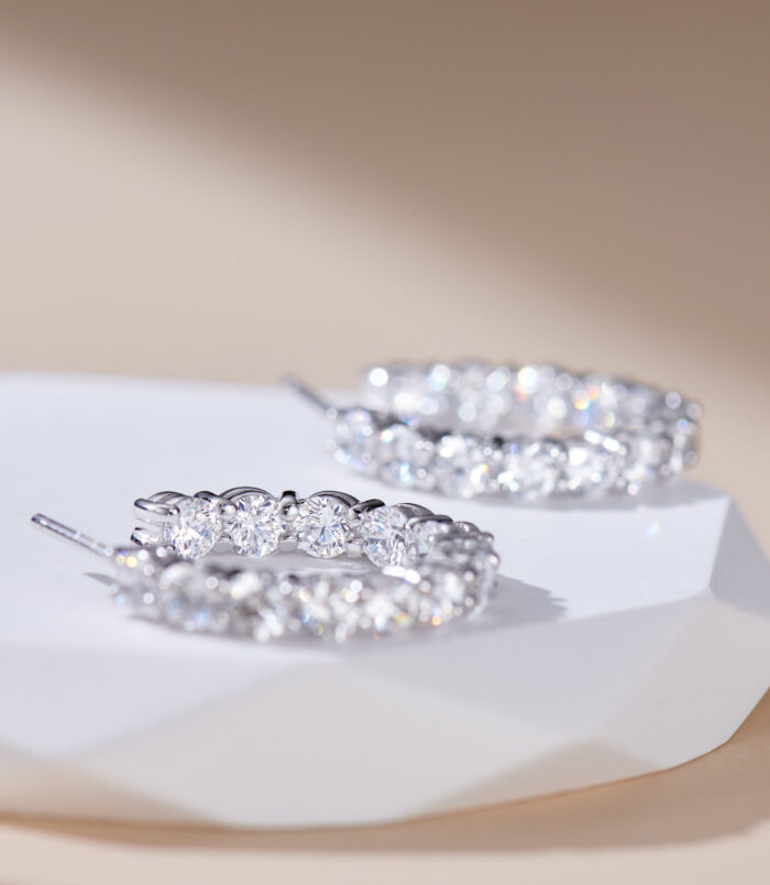 inner side close up of Sterling Silver Pavé-Set Huggie Hoop Earrings