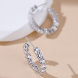 ear stick details of Sterling Silver Pavé-Set Huggie Hoop Earrings