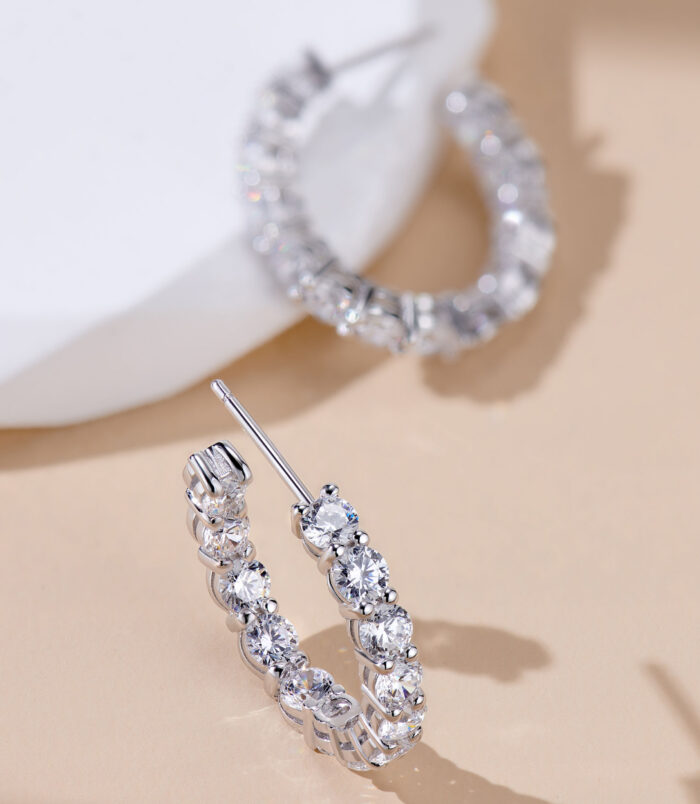 ear stick details of Sterling Silver Pavé-Set Huggie Hoop Earrings