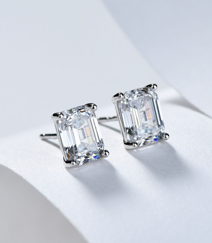 Sterling Silver Emerald-Cut Cubic Zirconia Stud Earrings Sterling silver stud earrings with a large emerald-cut clear cubic zirconia center stone.