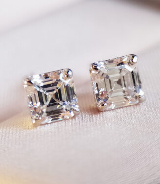 Sterling Silver Princess-Cut Cubic Zirconia Stud Earrings on a jewelry box
