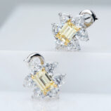 Sterling silver stud earrings with a central yellow rectangular gemstone surrounded by clear cubic zirconia halo.
