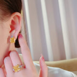 match Sterling Silver Yellow Cushion-Cut Halo Stud Earrings and rings display on a model