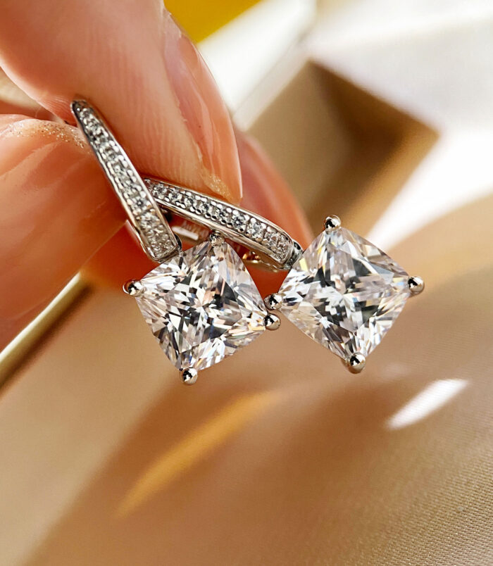 hand held close up of Sterling Silver Cushion-Cut Drop Earrings