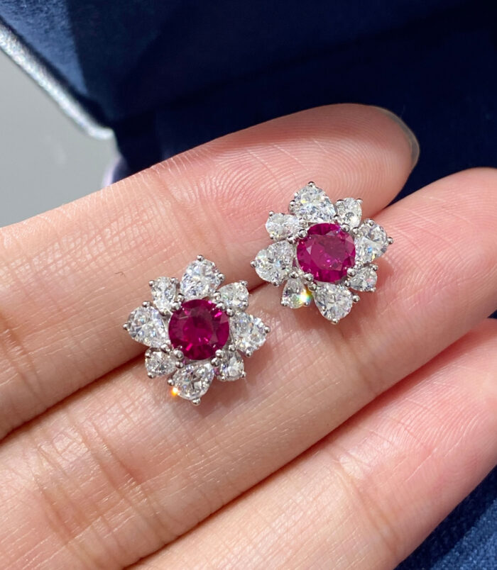 handheld close-up of Sterling Silver red flower Halo Stud Earrings