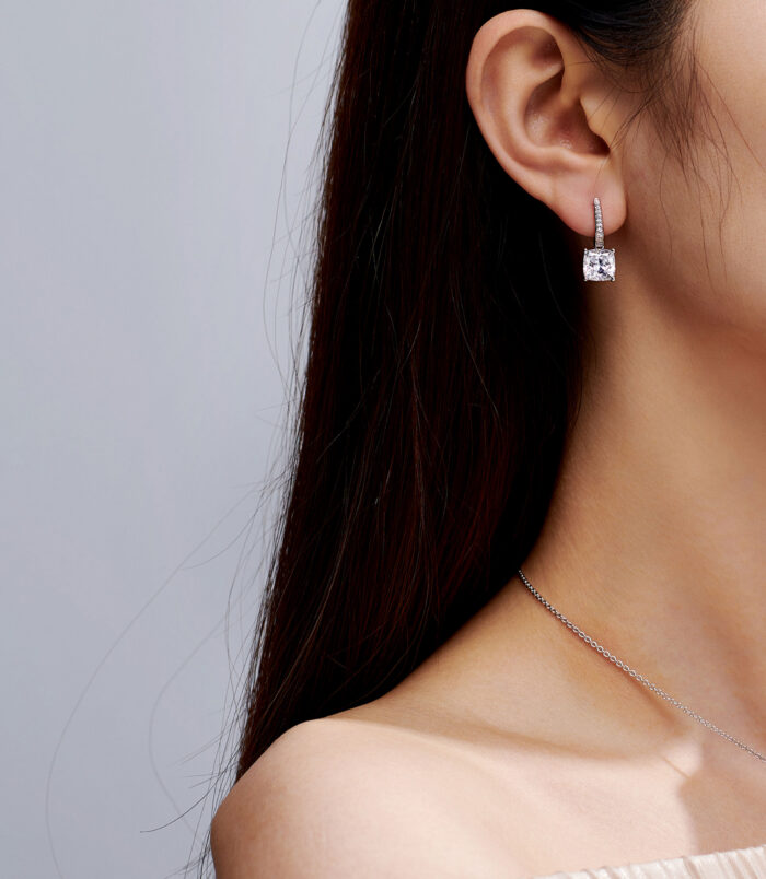 Sterling Silver Cushion-Cut Drop Earrings on a model's ears