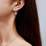 Sterling Silver Cushion-Cut Drop Earrings display on a model's ears