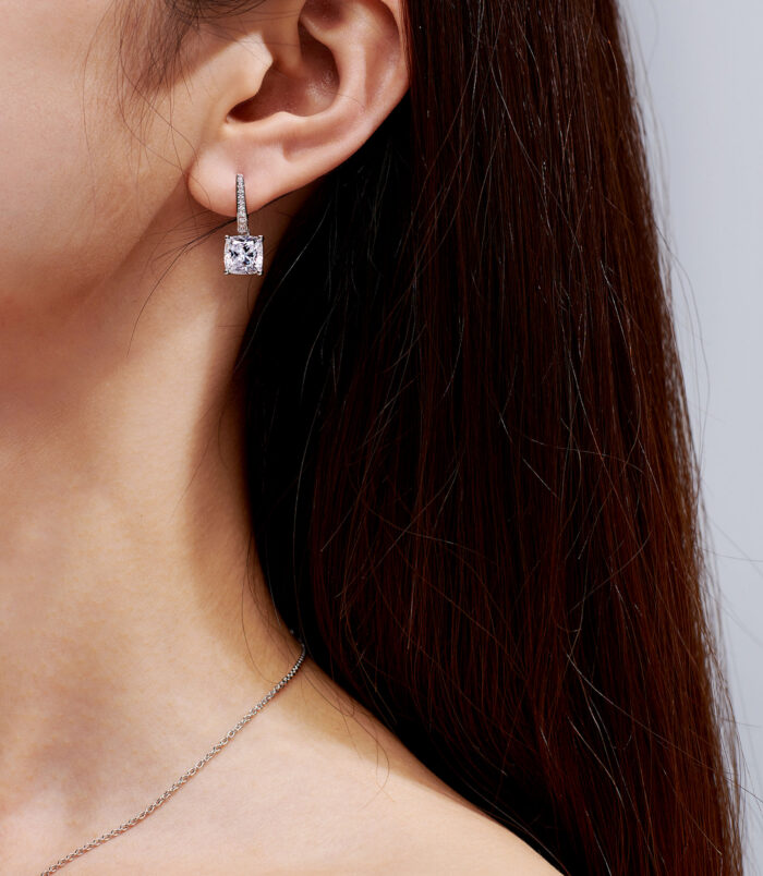 Sterling Silver Cushion-Cut Drop Earrings display on a model's ears