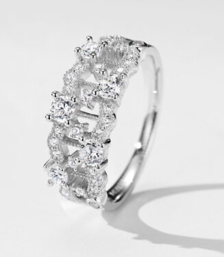 Stunning cluster-style sterling silver ring featuring multiple round brilliant-cut white cubic zirconia stones set in an intricate openwork band, creating a sparkling and luxurious look perfect for adding a touch of glamour to any outfit.