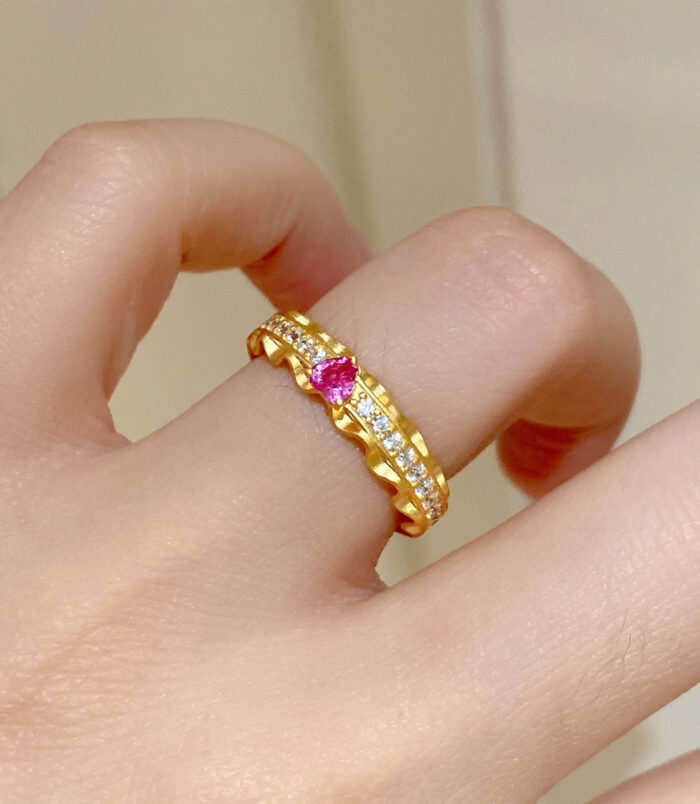 Enchanting Heart-Shaped Pink Zirconia Sterling Silver Ring worn on model's finger