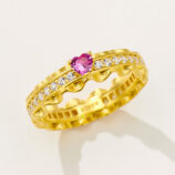 Romantic gold-plated sterling silver eternity ring featuring a central heart-shaped pink cubic zirconia stone flanked by round brilliant-cut white cubic zirconia stones set in a scalloped band, creating a feminine and elegant look perfect for expressing love and affection.