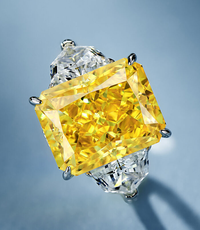 main stone close-up of Luxury Yellow Emerald-Cut Three-Stone Sterling Silver Ring
