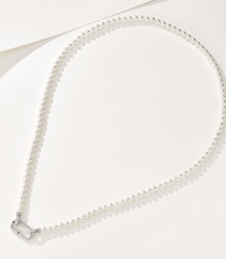 Elegant sterling silver necklace featuring a single strand of small round white freshwater pearls, secured with a decorative sterling silver clasp adorned with round brilliant-cut white cubic zirconia stones, creating a classic and sophisticated look perfect for adding a touch of timeless elegance to any outfit.