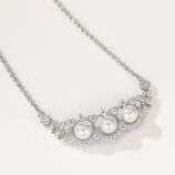 side view close-up of Fan-shaped pearl lace necklace