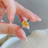 hand held close-up of Cushion-Cut Yellow gemstone Sterling Silver Solitaire Ring
