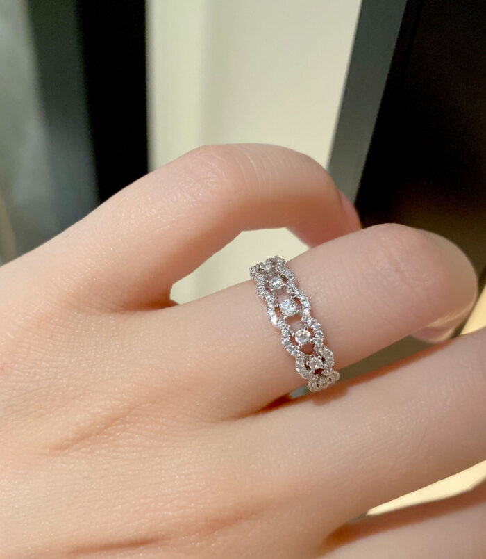 Sparkling Twisted Infinity Sterling Silver Ring wearing effect Sparkling Twisted Infinity Sterling Silver Ring worn on model's finger