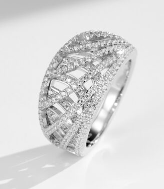 Stunning sterling silver band ring featuring an intricate criss-cross design adorned with sparkling round brilliant-cut cubic zirconia stones set in a pavé setting, creating a bold and glamorous look perfect for making a statement and adding a touch of luxury to any outfit.