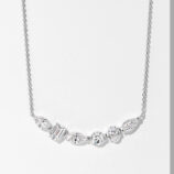 Elegant sterling silver smile necklace, featuring a row of mixed-cut white cubic zirconia stones including emerald-cut, round brilliant-cut, and marquise-cut stones, set in a sleek bar design, paired with a classic cable chain, creating a sophisticated and modern look perfect for adding a touch of luxury to any outfit.