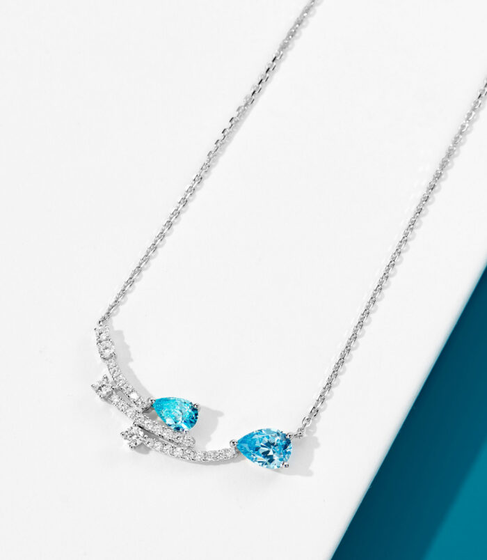 Sterling Silver Blue Zirconia Stones and Star Accents Necklace side view side view close-up of Sterling Silver Blue Zirconia Stones and Star Accents Necklace