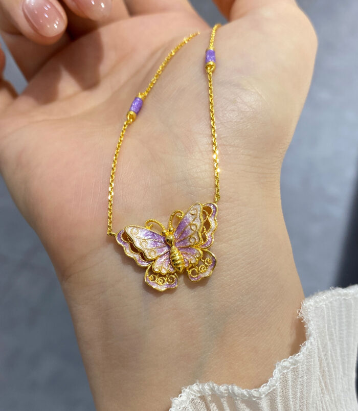 close-up of Sterling silver purple enamel butterfly necklace