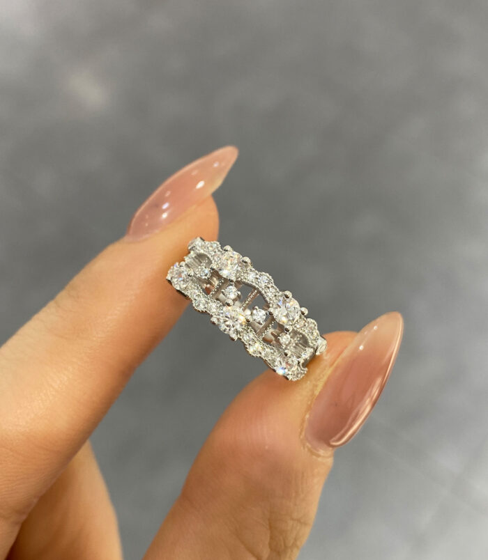 hand held close-up of Sparkling Intricate Openwork Sterling Silver Ring