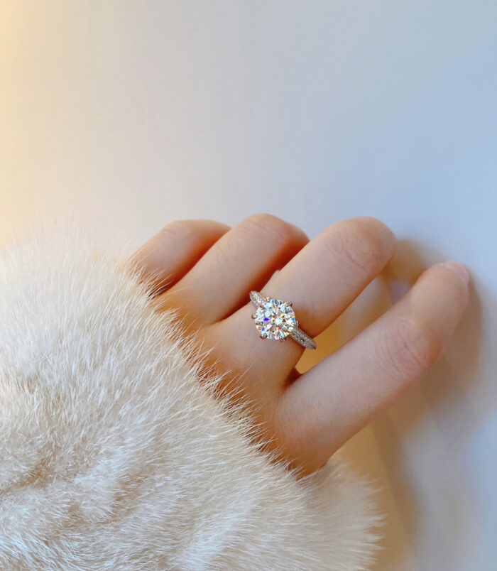 Solitaire Cubic Zirconia Sterling Silver Engagement Ring worn on a model's finger