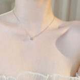 Sleek Sterling Silver Solitaire zirconia Necklace worn on model's neck