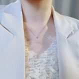 Sleek Sterling Silver Solitaire zirconia Necklace display on model's neck